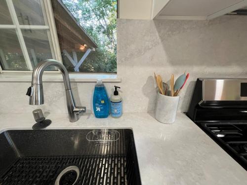 a kitchen counter top with a sink and a sink at Quiet and Central 1bed1bath House, Nature Retreat in Rosemead