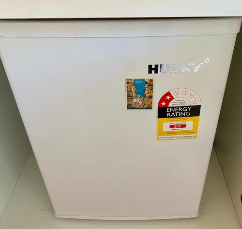 a white refrigerator with a hudson energy rating sticker on it at Coastal Escape in Maroochydore