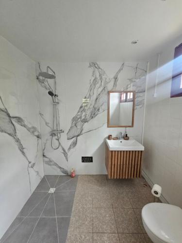 a bathroom with a sink and a mirror at Zen'Nature&Chill House - Punta Cana Room in Petit-Canal