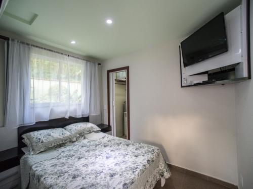 Postel nebo postele na pokoji v ubytování Sweet Rio Residence Taquara