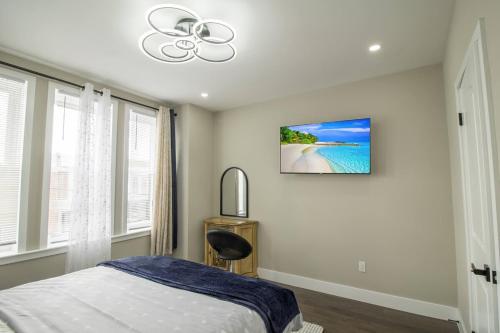 a bedroom with a bed and a clock on the wall at Home in Philadelphia Stadium nearby in Philadelphia
