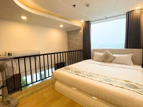 Ένα ή περισσότερα κρεβάτια σε δωμάτιο στο Bighotel Can Tho
