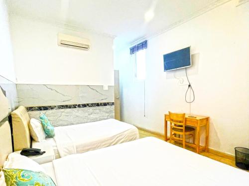 Ένα ή περισσότερα κρεβάτια σε δωμάτιο στο Bighotel Can Tho