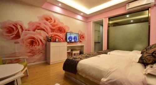 a bedroom with a bed with a flower mural at Dali Dayu Hotel in Dali