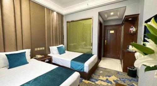 Dunhuang Dunhe Hotelにあるベッド