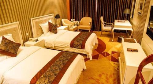 Ένα ή περισσότερα κρεβάτια σε δωμάτιο στο Metropark Hotel