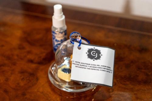 a bottle of soap with a tag on it at Hotel Boutique Casa del Jardín Aguascalientes in Aguascalientes