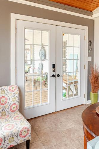 a room with french doors leading to a patio at Flatt Creek Cottage in Livingston