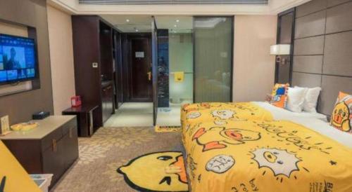 Postel nebo postele na pokoji v ubytování Enping Yucca Hotel