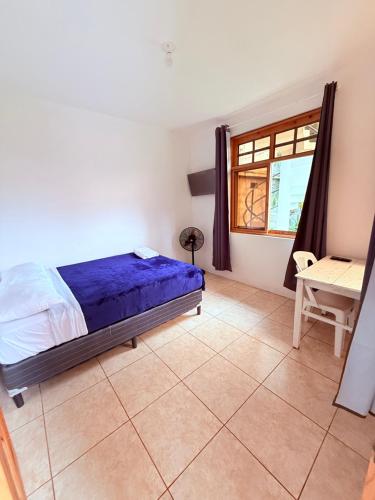 Ένα ή περισσότερα κρεβάτια σε δωμάτιο στο Apartamentos Tzununya Colibri