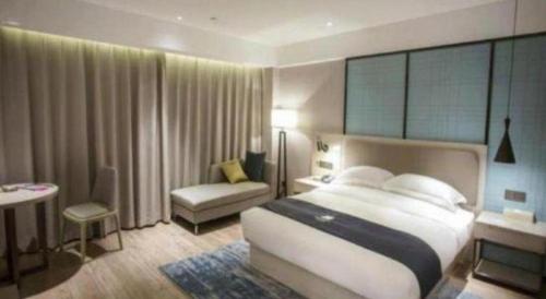 Ένα ή περισσότερα κρεβάτια σε δωμάτιο στο Echarm Hotel Jianshui Gucheng