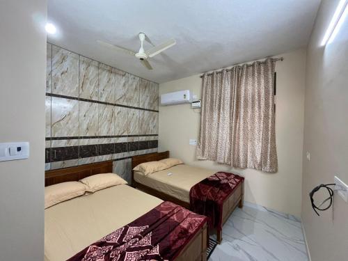 Ένα ή περισσότερα κρεβάτια σε δωμάτιο στο VS Homestay