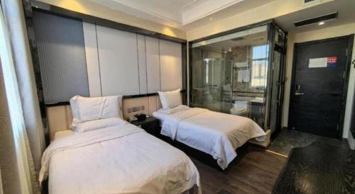 Postel nebo postele na pokoji v ubytování PAI Hotels Shijiazhuang Zhengding Gucheng