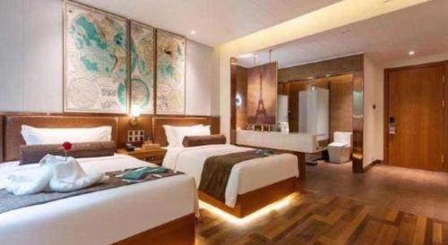 a hotel room with two beds and a bathroom at James Joyce Coffetel Harbin West High-speed Railway Station Wanda Plaza in Harbin