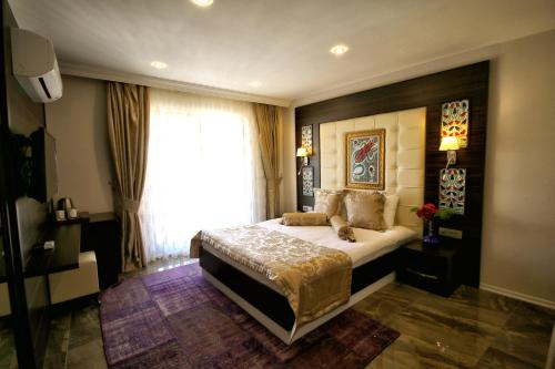 Cama o camas de una habitación en Venus Suite Hotel
