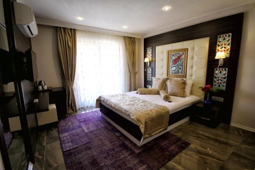 Cama o camas de una habitación en Venus Suite Hotel