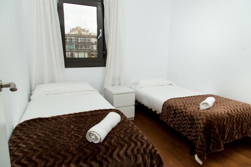 En eller flere senger på et rom på Autèntic Eixample Barcelona