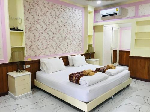 Postel nebo postele na pokoji v ubytování Malangpor Hotel