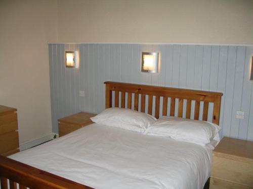 A bed or beds in a room at The Barrington Hotel 