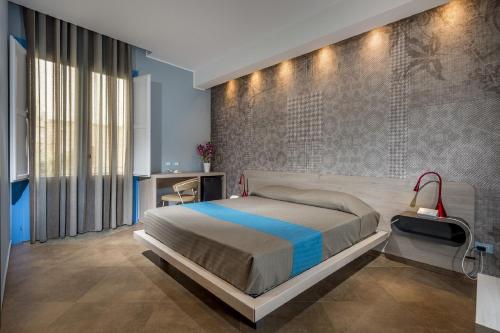 Postel nebo postele na pokoji v ubytování Hotel Vento del Sud