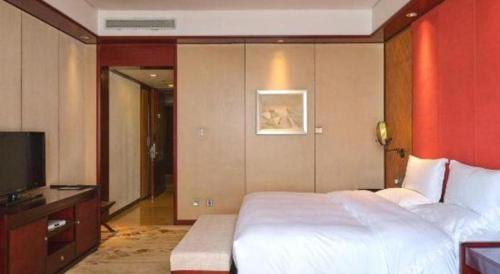 Cama o camas de una habitación en Langfang Ovation Hotel