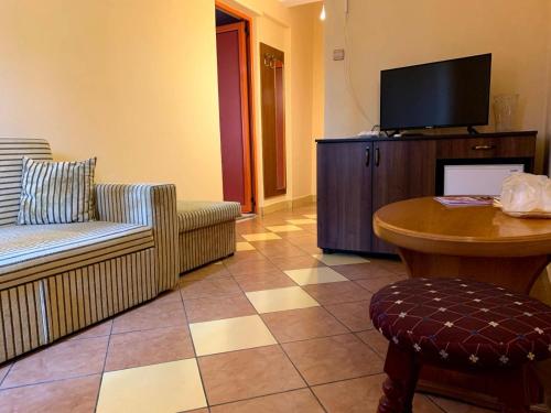 TV a/nebo společenská místnost v ubytování Hotel Nalba-Dalia Jupiter