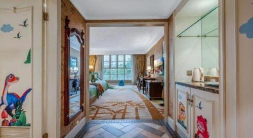 a hallway of a home with a kitchen and a living room at Hangzhou The First World Hotel in Hangzhou
