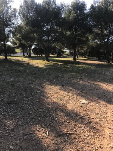 a park with trees and a dirt field at Studio calme entre Aix et Marseille in Les-Pennes-Mirabeau