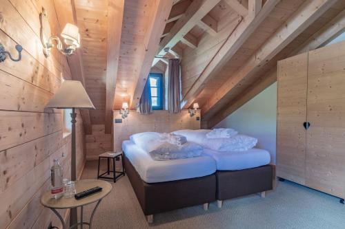 Postel nebo postele na pokoji v ubytování Rinderberg Lodge