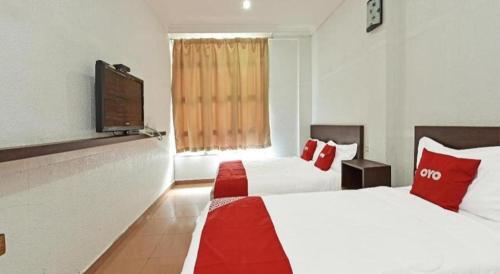 Katil atau katil-katil dalam bilik di OYO 90559 Ummul Motel C Mart