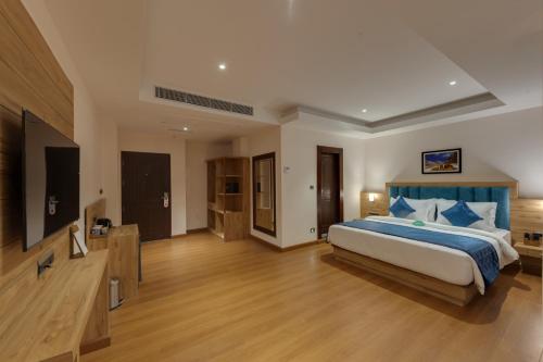 Ένα ή περισσότερα κρεβάτια σε δωμάτιο στο Clarion Hotel De Renees Gangtok