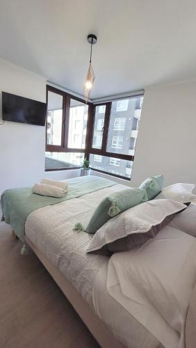 Letto o letti in una camera di Bello depto edificio Claro Solar 3 a 5 personas