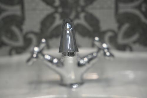 a close up of a toothbrush in a sink at Maison Canopée in Messina