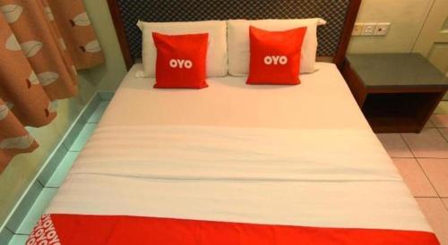 Кровать или кровати в номере OYO 89642 Highway Inn