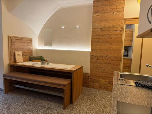 a bathroom with a sink and a counter with a counter at Boutique Apartment BERGLIEBE, ski in-out in Saalbach Hinterglemm