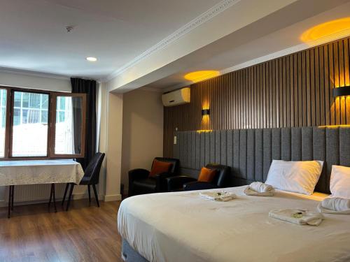 Postel nebo postele na pokoji v ubytování Naila Hotel