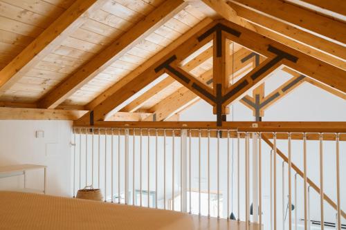 a large room with wooden ceilings and beams at Casolare Cento Ulivi Luxury & Charme in Ascea