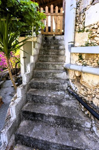 a set of stairs leading up to a house at Villa Folia - PassiveinCreteBns in Maroulás