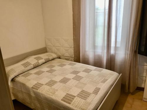 Postel nebo postele na pokoji v ubytování Casa Tre Fontane