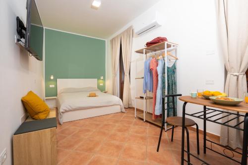 Postel nebo postele na pokoji v ubytování L'Arco nel Corso