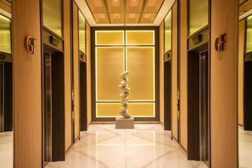 a room with a statue in the middle of a building at Tokyo Riverside PIK 2 by Kakarama Room in Muara