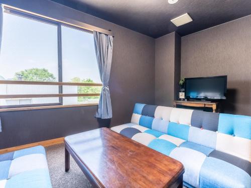 Télévision ou salle de divertissement dans l'établissement RV park plus Numata Kenko Land