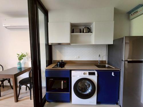 a kitchen with a washing machine in a kitchen at The Base Central Phuket-B32YJ in Ban Rangeng