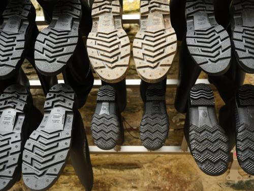 a bunch of shoes on a rack in a store at Fowlescombe Farm in Ugborough