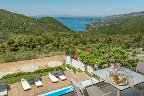 a villa with a view of the ocean at Ninemia Luxury Residence in Perdika