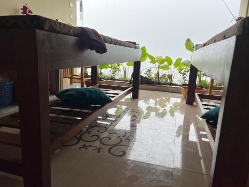 Ένα ή περισσότερα κρεβάτια σε δωμάτιο στο Makna Homestay and Spa