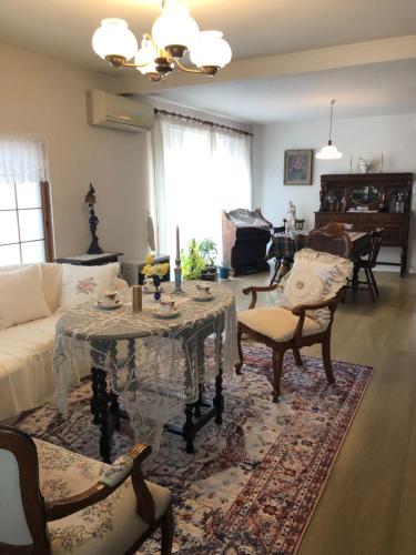 a living room with a table and a couch at 小樽祝津山荘2号楼 in Otaru