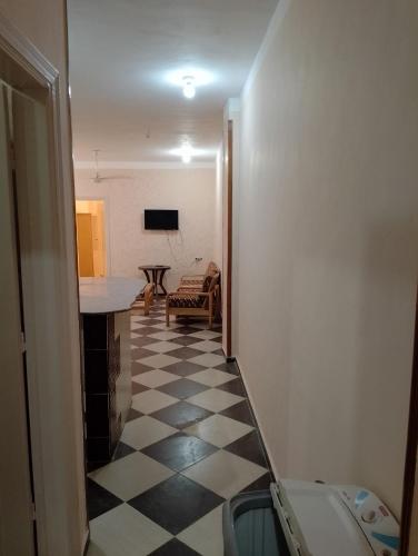 a hallway with a room with a checkered floor at برج القط للشقق الفندقيه المفروشة in Marsa Matruh