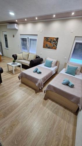 Llit o llits en una habitació de Ramonda Apartment