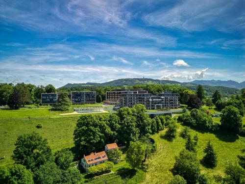 an aerial view of a campus with trees and buildings at Les Terrasses de Lavaux-2 Appartement de Luxe avec Vue Panoramique et Piscine" in Chexbres
